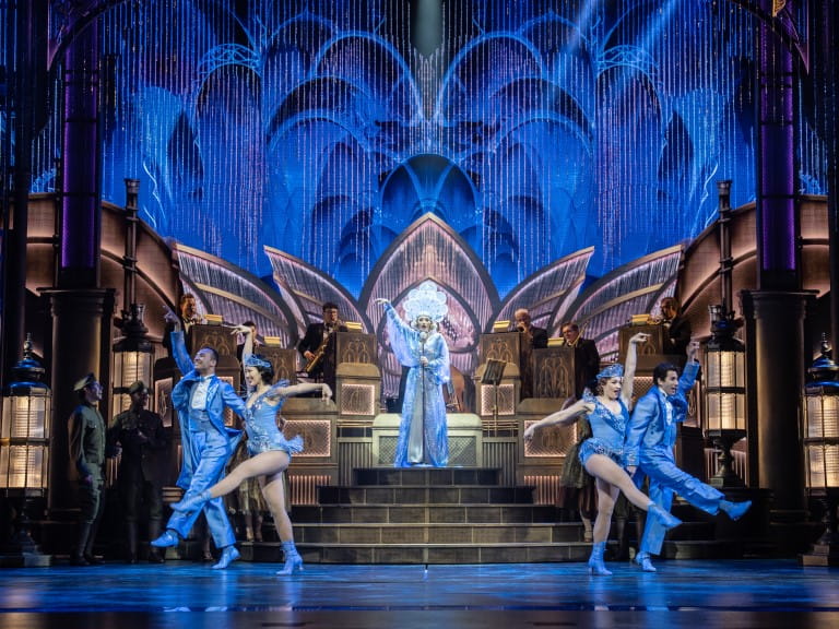 A blue-tinted dance number being performed