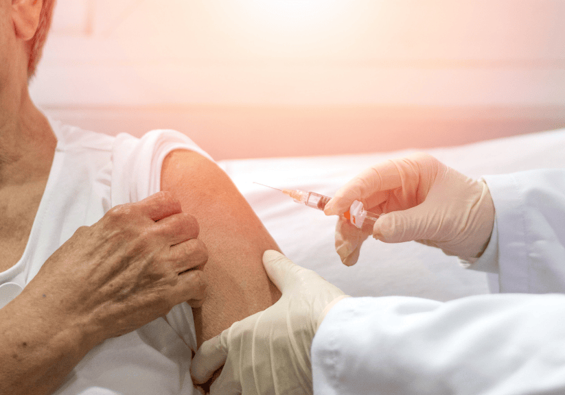 a woman having a shingles jab