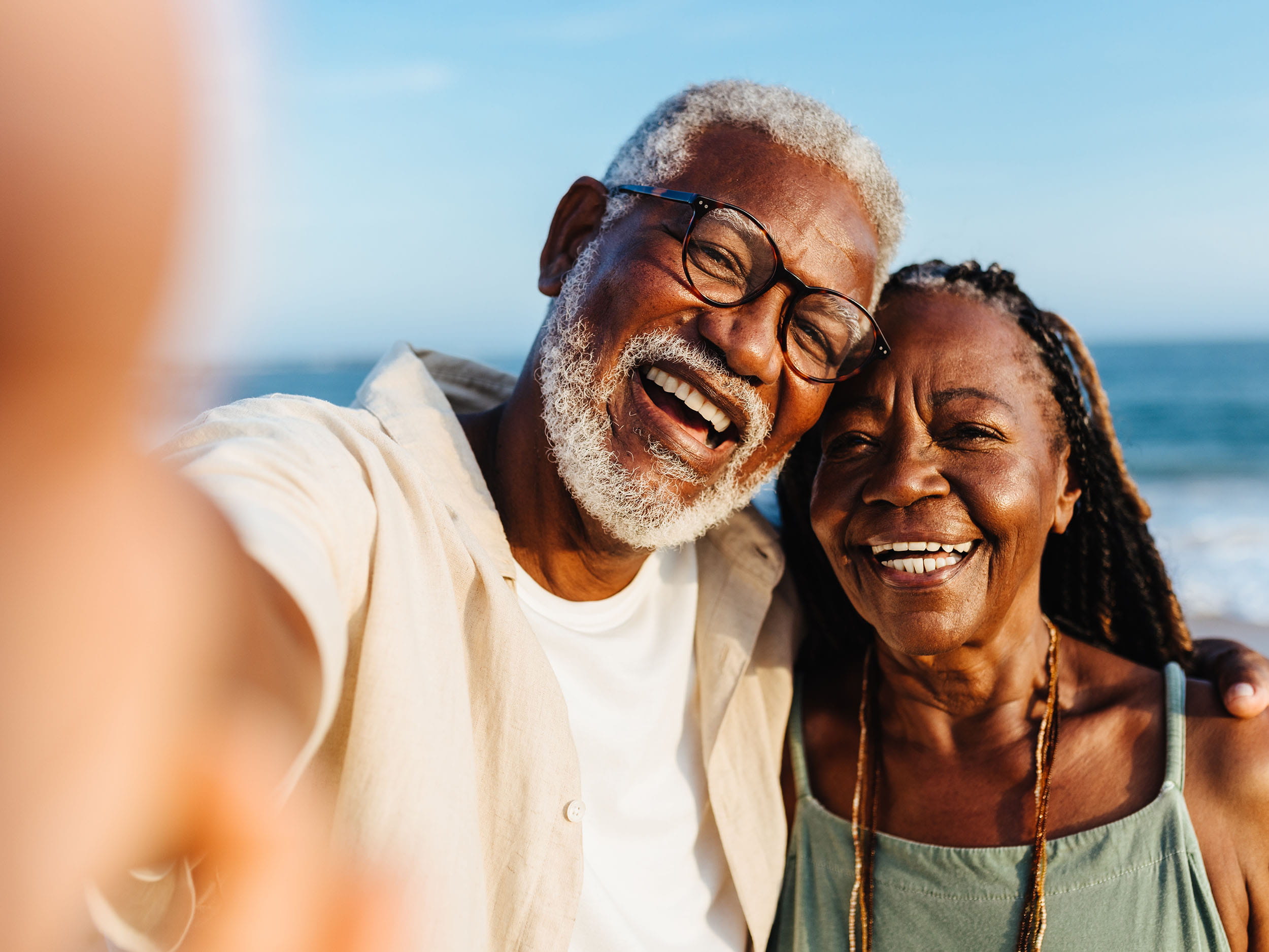 An older couple smiling at the camera