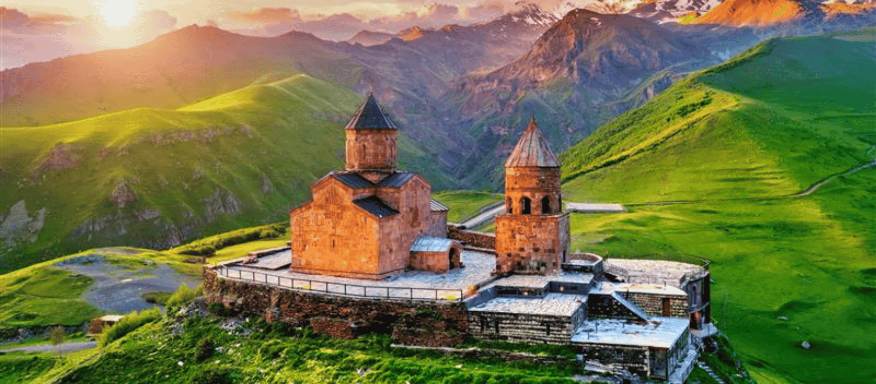 Aerial view of Gergeti trinity church at sunrise in Georgia