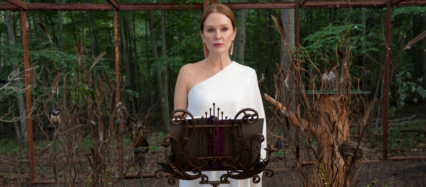 Julianne Moore in Sirens stood behind a lectern