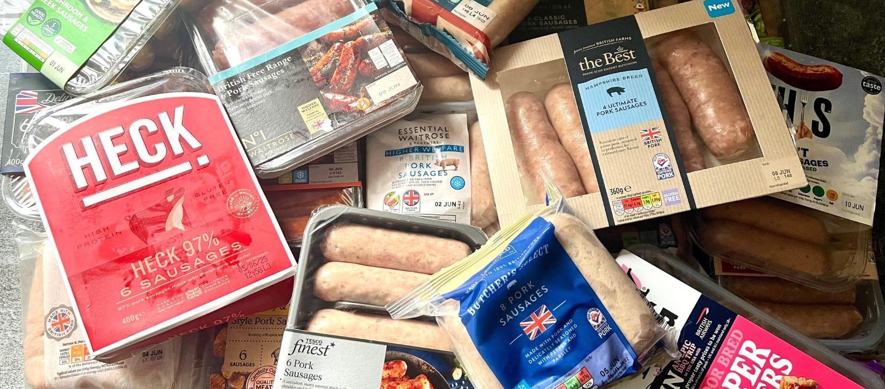 a selection of supermarket sausages in their packets