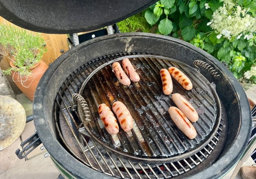 A selection of sausages on a charcoal bbq