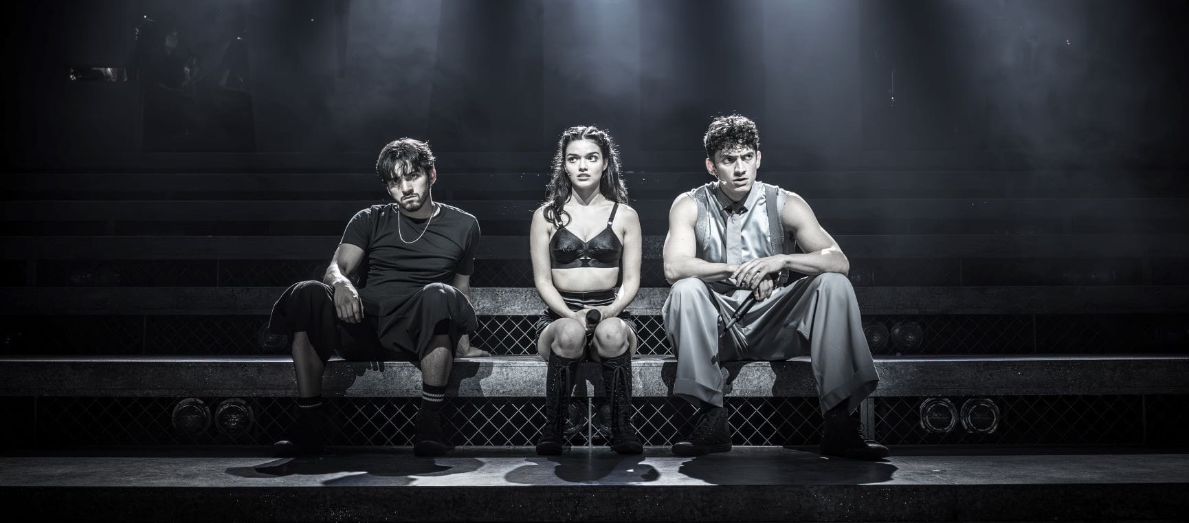 The main cast sat at the front of the stage