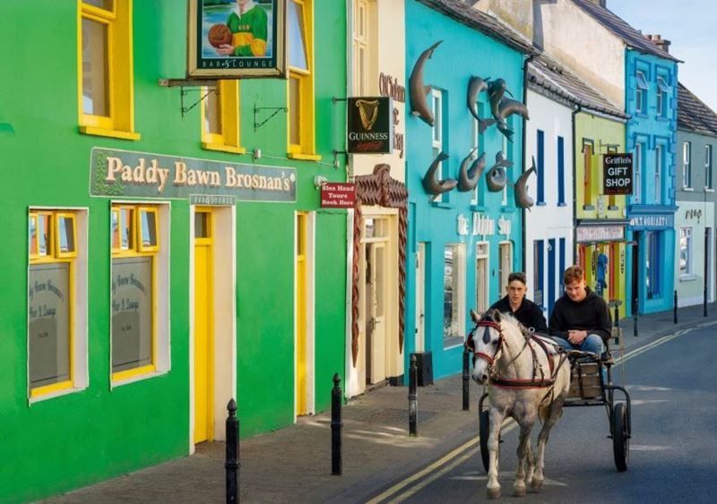Dingle’s colourful high street with a horse and cart