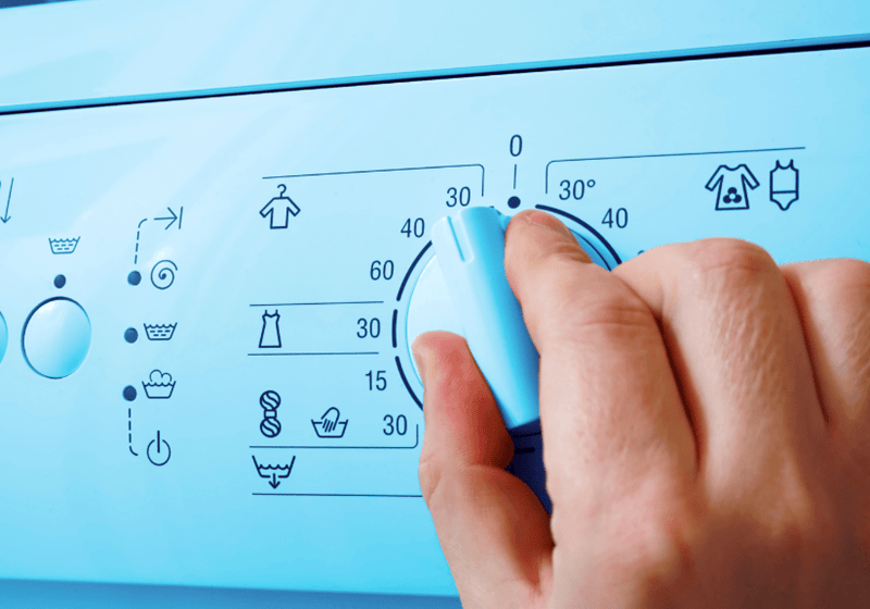 the front of a washing machine showing the different cycles