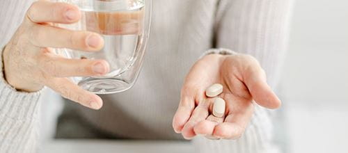 Woman taking vitamins