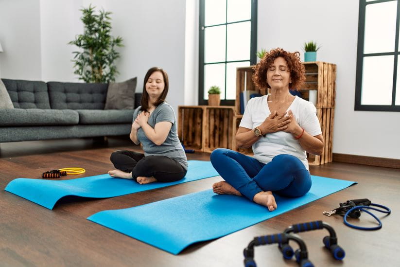 Woman on the floor holding her heart