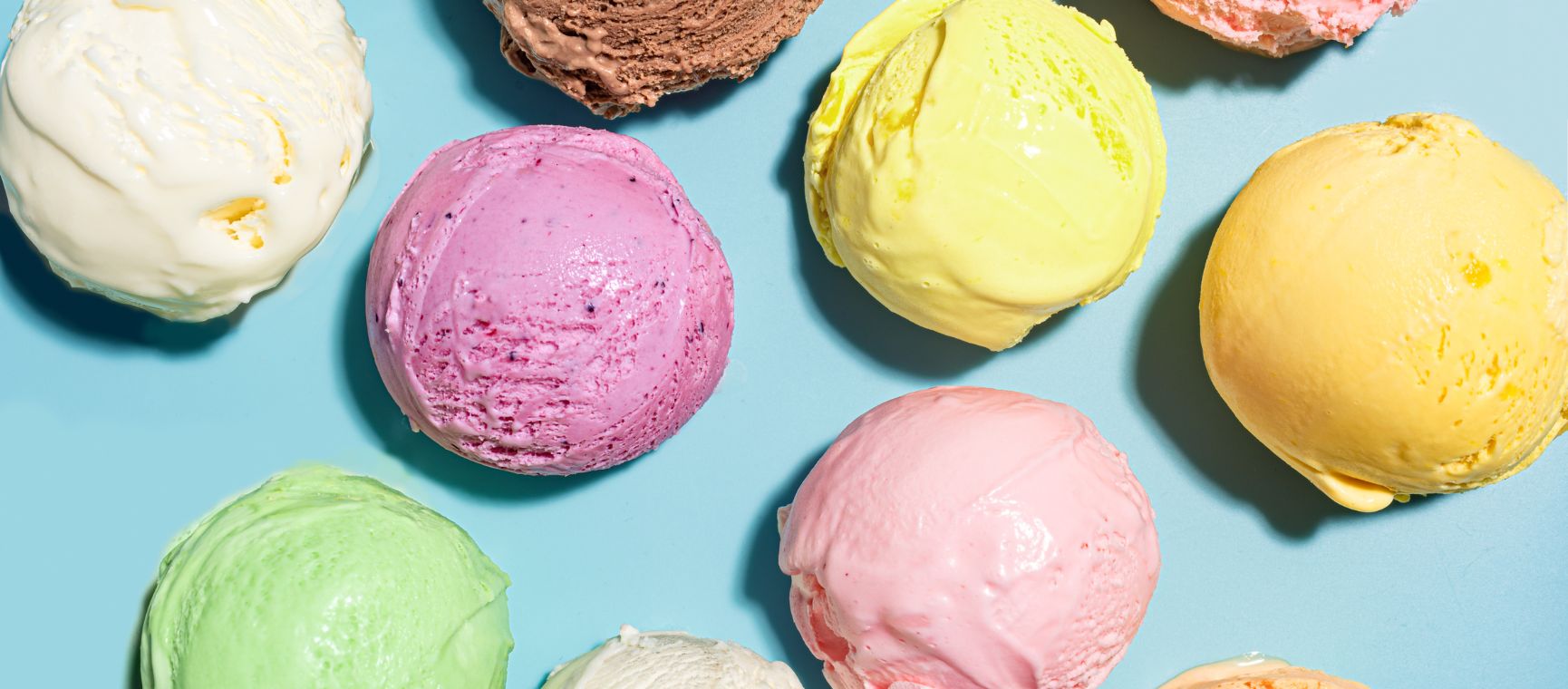 A flat lay of different types of scoops of ice cream