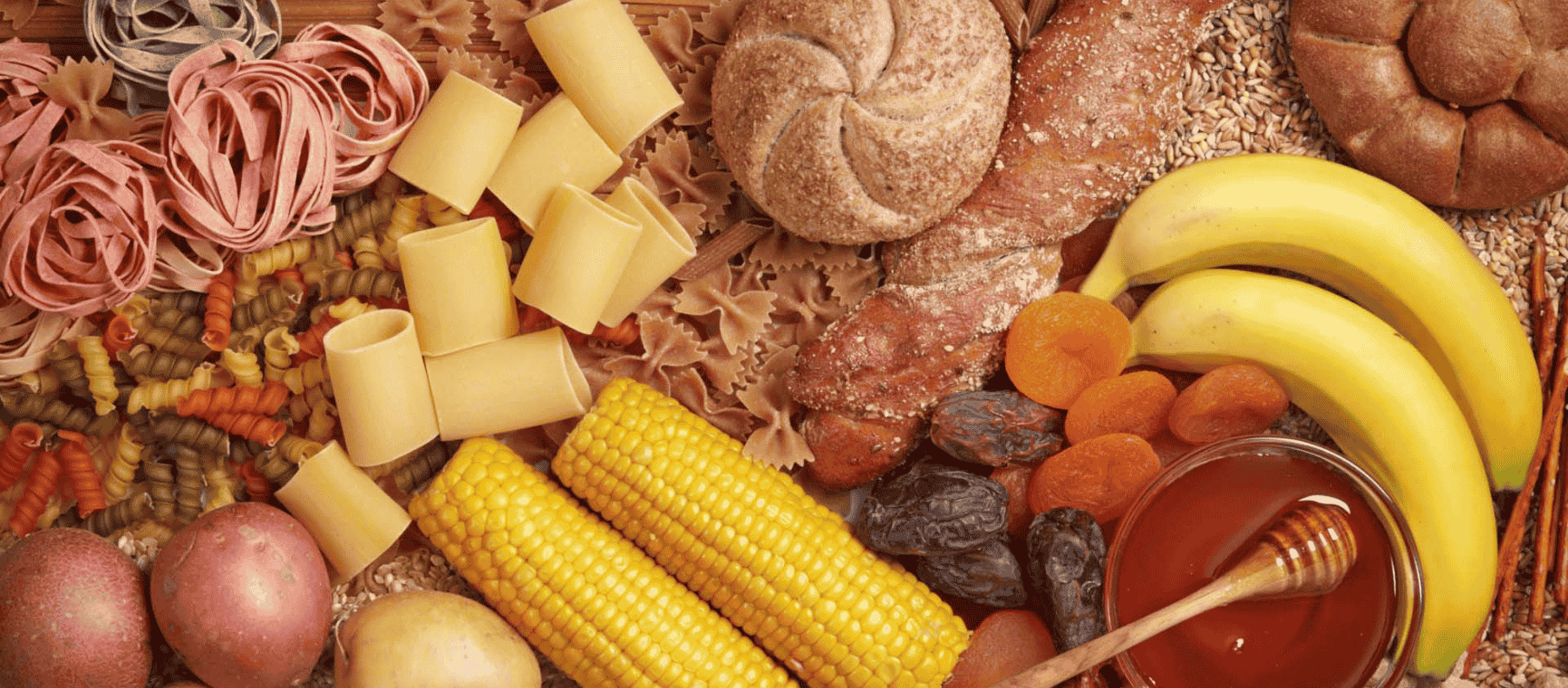 A selection of carbohydrate foods including bananas and breads