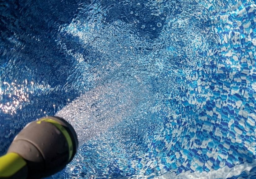 Filling a swimming pool with a hosepipe