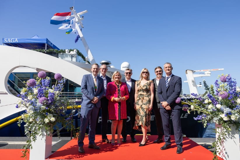 Louise Robinson and Saga co-workers in front of the Spirit of the Moselle