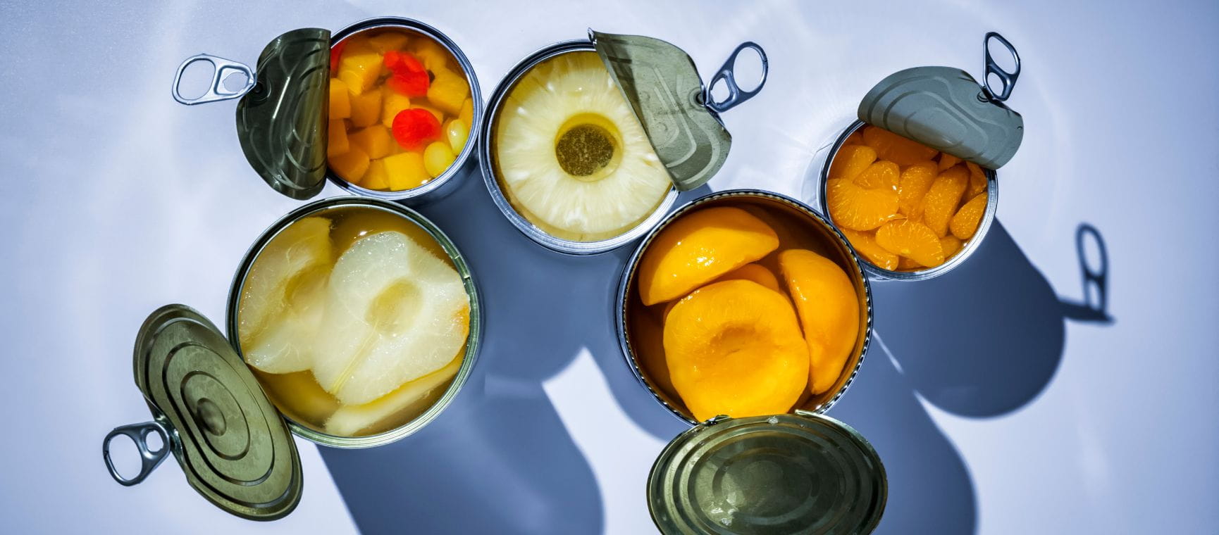 a photo taken from overview of various types of tinned fruit