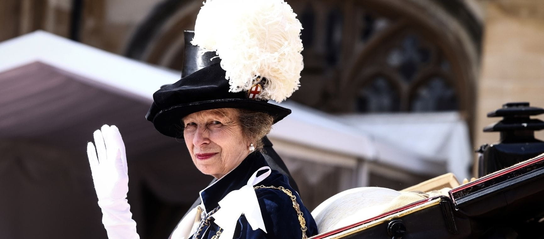 Princess Anne waving from her carriage