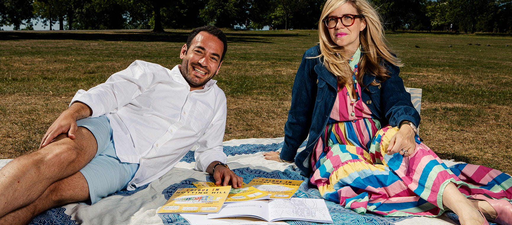 Emma Barnett and husband Jeremy sitting in a park on a picnic blanket