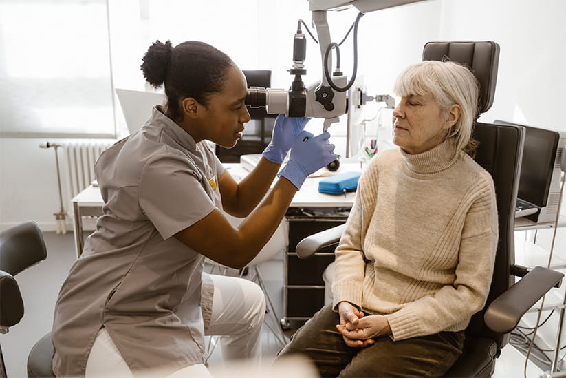 An older woman having her eyesight tested
