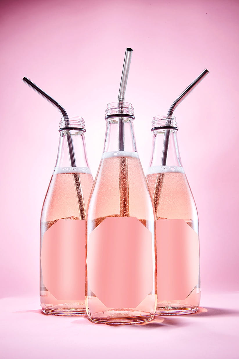 Three bottles of pink drink