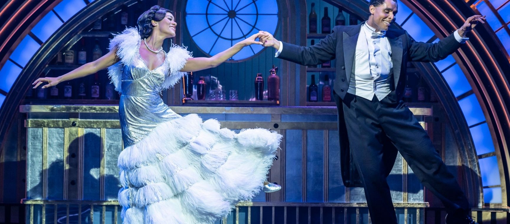 A man and a woman dancing in the musical of Top Hat
