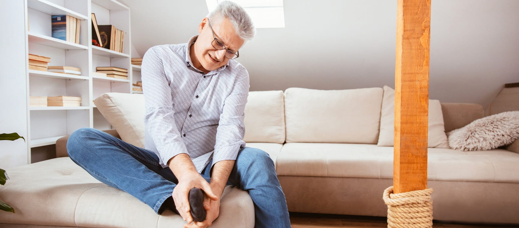 Senior man suffering with foot pain