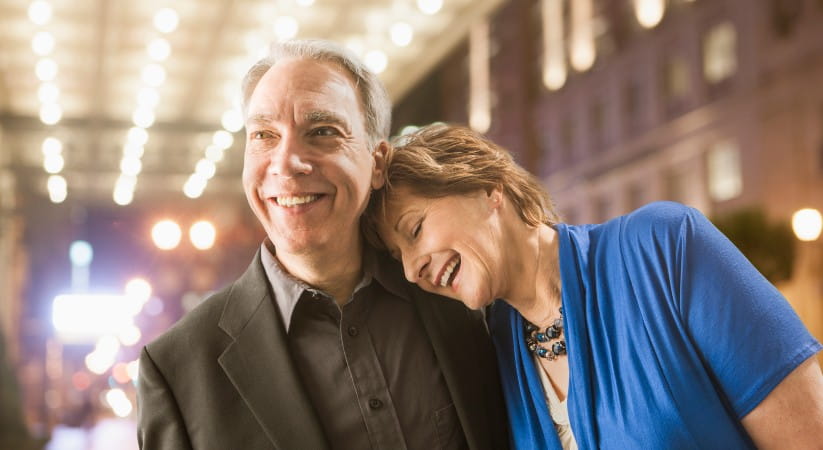 Older couple laughing on night out