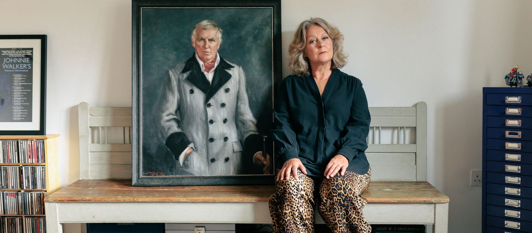 Tiggy Walker sits in front of a portrait of her late husband, the radio DJ Johnnie Walker