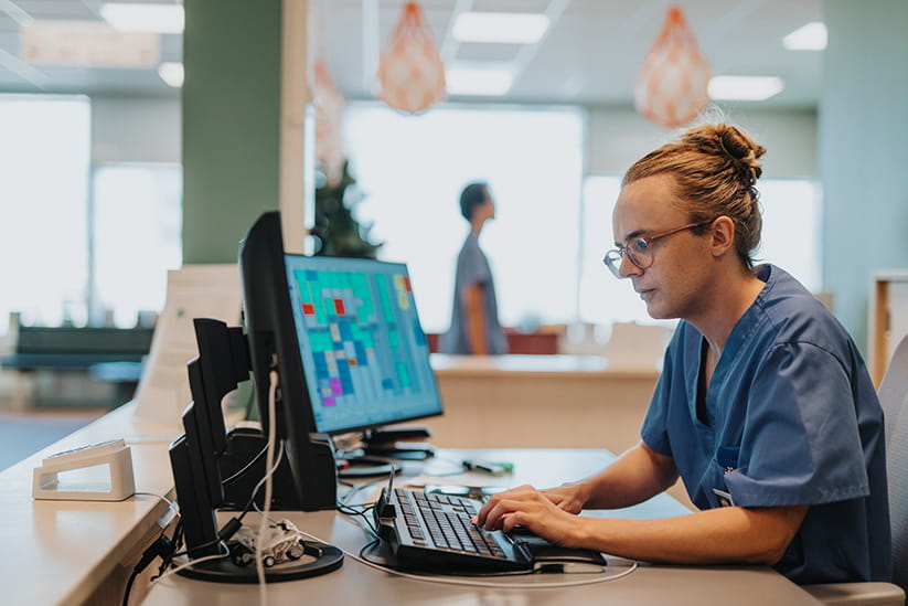 A medical professional using a computer