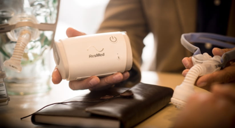 Person holding Resmed AirMini