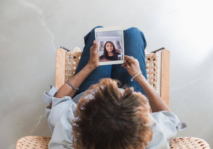 A woman looking at her computer tablet