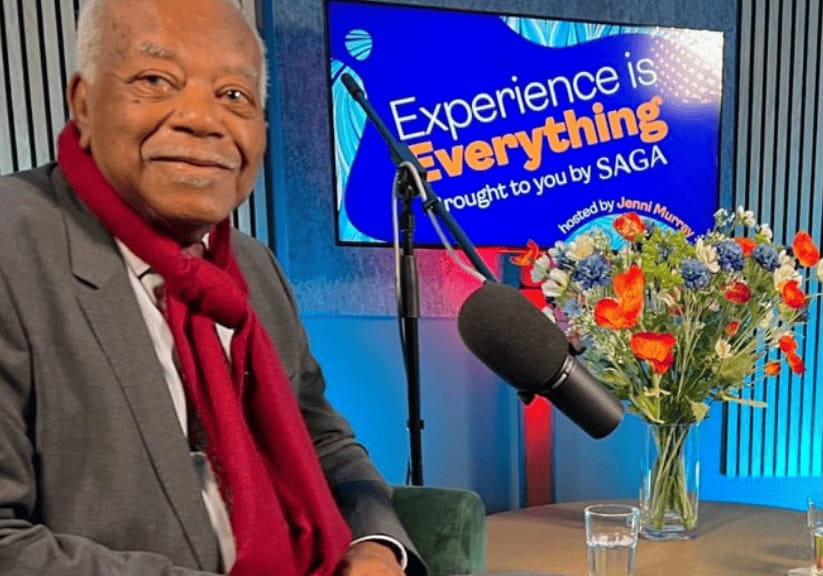 Trevor Mcdonald in front of the Saga Experience is Everything logo