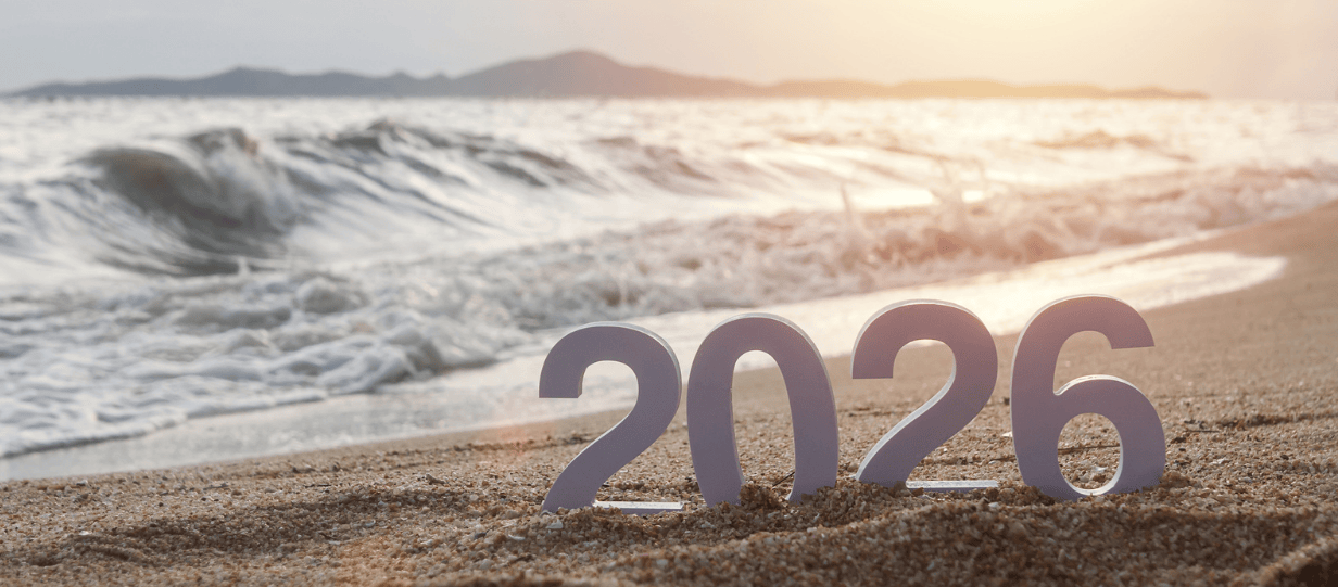 The numbers 2026 on a sunlit beach