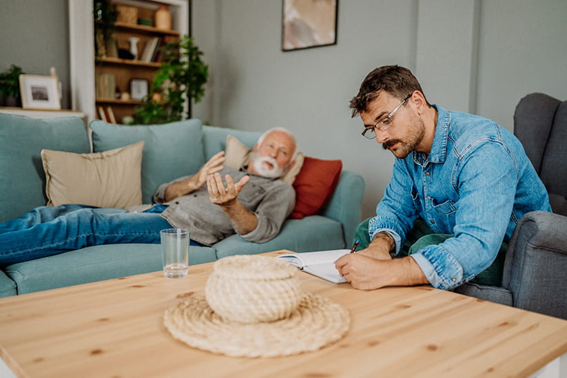 An older man explaining what he wants from hypnotherapy to his hypnotherapist