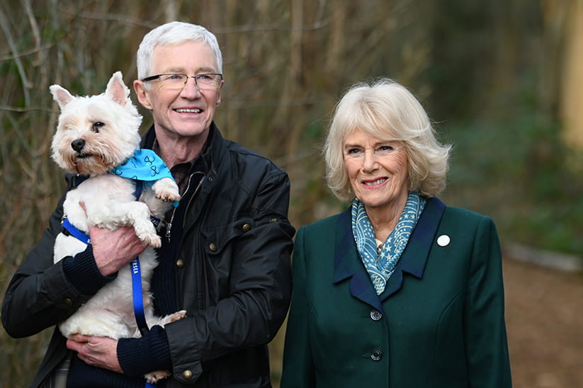 Paul O'Grady and Queen Camilla with a dog 