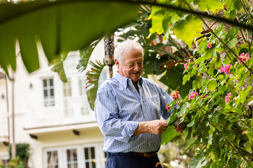 An older man gardening