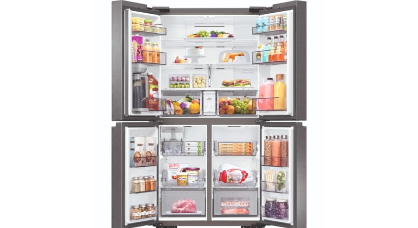 Samsung fridge freezer with open doors against a white background