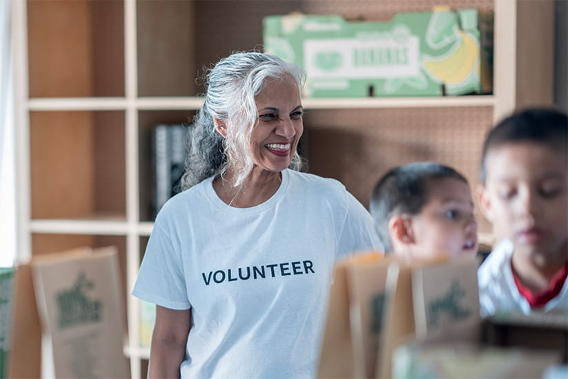 An older woman volunteering in her local community