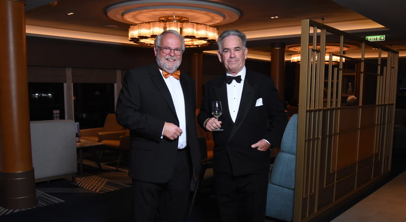 The Venerable Hugh McCurdy stands with Mark Palmer aboard a Saga cruise ship