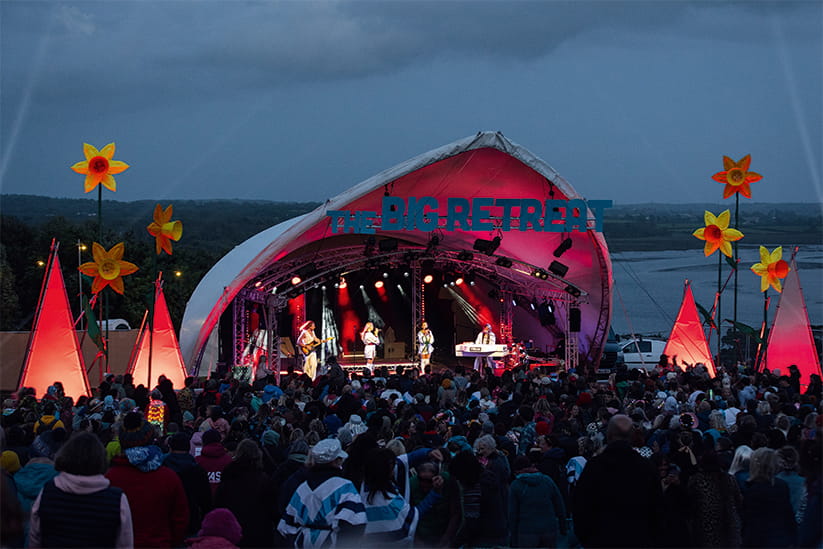 A performance at dusk at The Big Retreat
