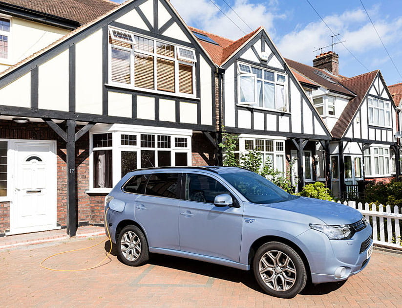 Go Ultra Low Mitsubishi Outlander PHEV on charge on a London driveway