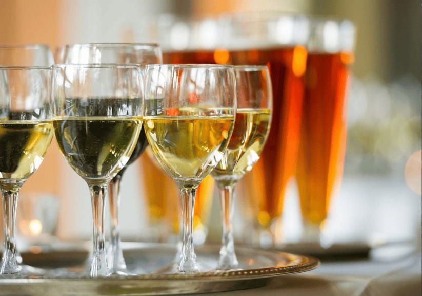 A tray of wine and beer glasses