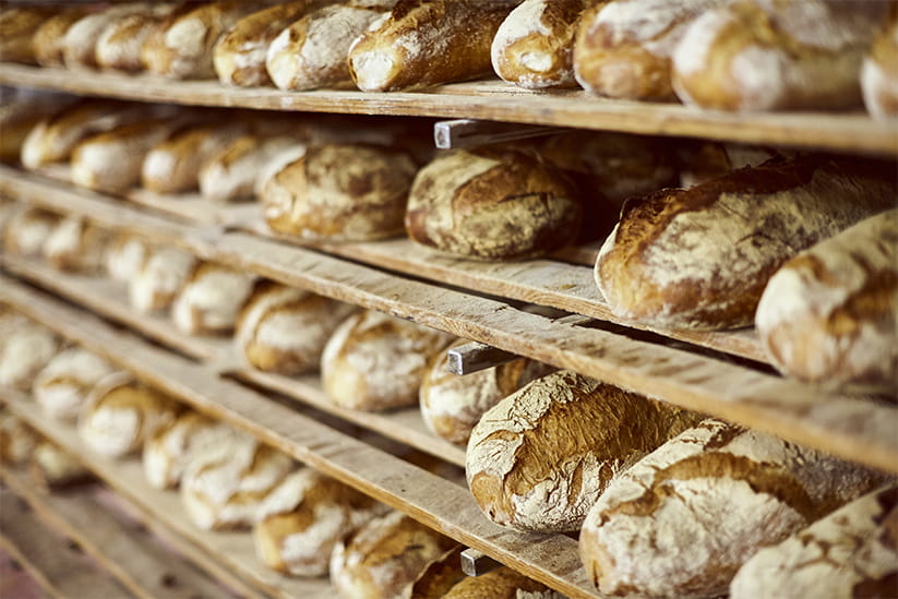 Rows of bread on a shelf
