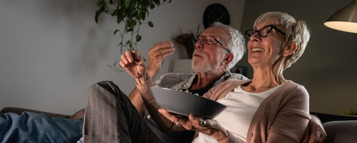 Two people eating in the evening