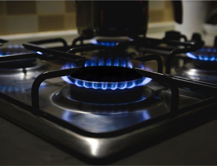 Close up image of gas burning on a kitchen stove