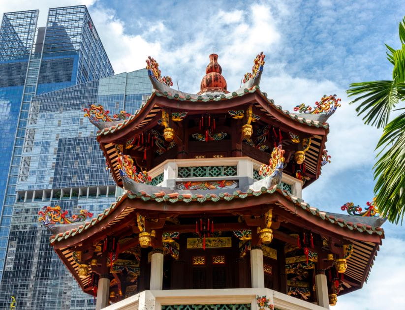 A temple against a backdrop of skyscrapers in Singapore