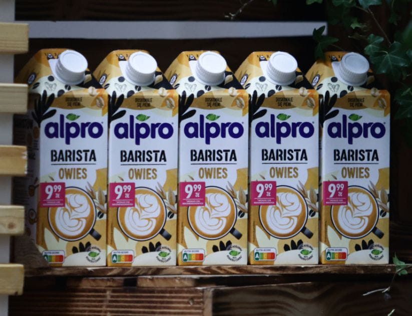 Alpro Barista oat milk arranged in a stand in Krakow