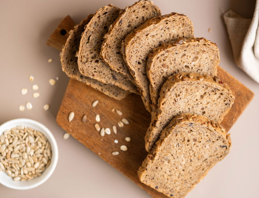 delicious looking whole grain bread with seeds cut in slices