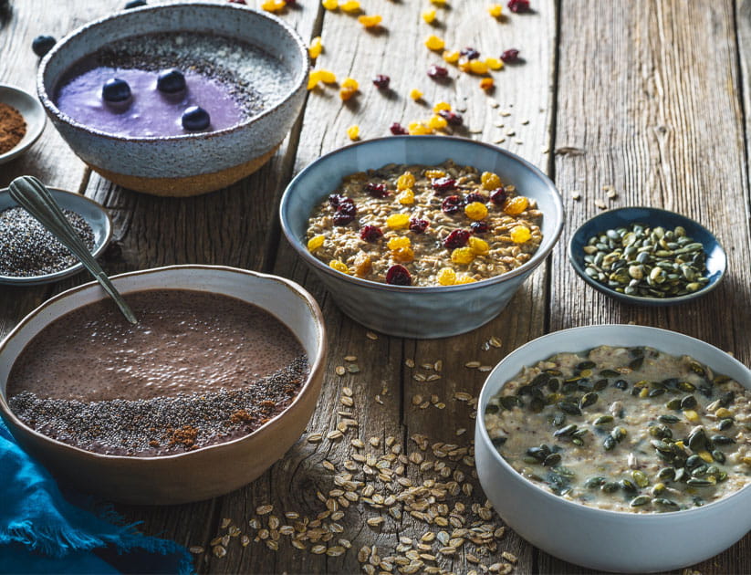 Assorted breakfast bowls as overnight oats, Chocolate chia pudding, Morning Porridge and Blueberry smoothie all plant based recipes