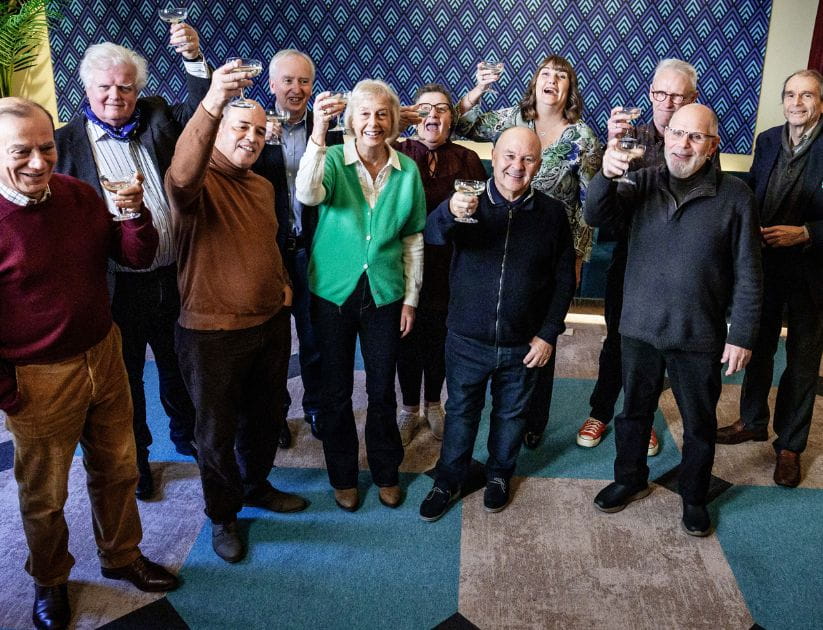 A group photograph of the the stars in their seventies