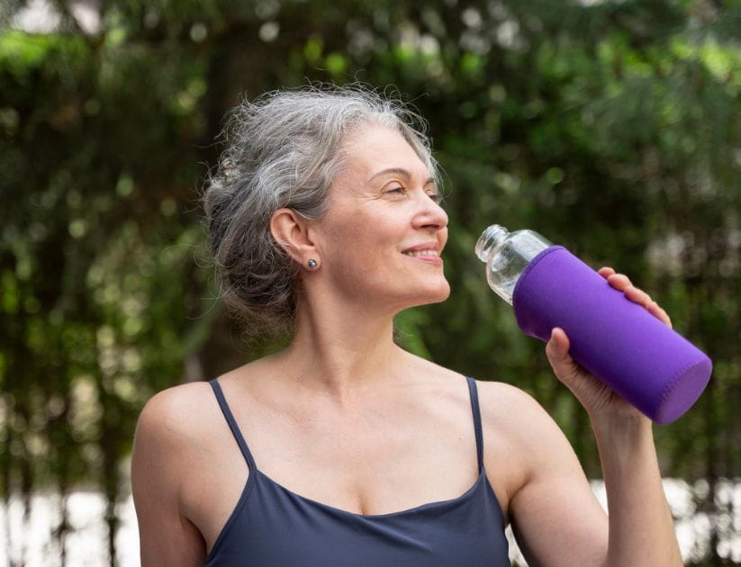Woman holding water bottle
