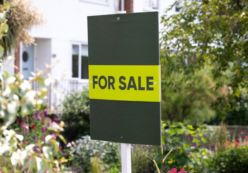 A for sale sign outside a house