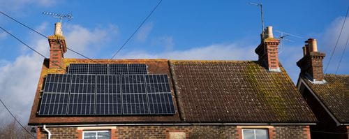 Roof of a house with solar panels on them
